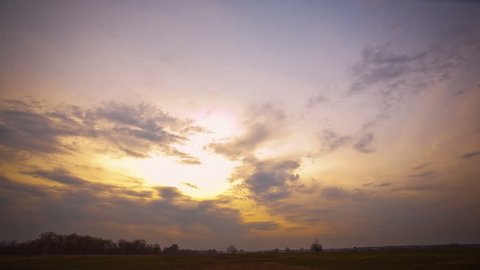 Sunset with clouds . Time lapse clip without birds,insects