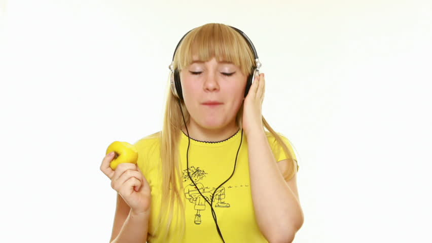Young lady listens to music on a white background-1
