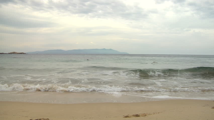 Mediterranean beach with breaking wave