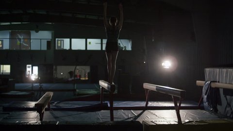 Young Female Gymnast Practicing for Competition with Advanced Acrobaticsの動画素材