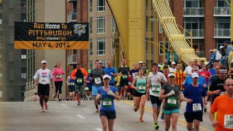 PITTSBURGH, PA - Circa May, 2014 - Runners cross the Andy Warhol Bridge in the 2014 Pittsburgh Marathon.  For editorial use only.