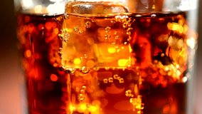 Cola background. Cola with Ice and bubbles in glass. Food background. Stock full HD video footage 1920x1080p, 1080