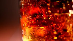 Cola background. Cola with Ice and bubbles in glass. Food background. Stock full HD video footage 1920x1080p, 1080