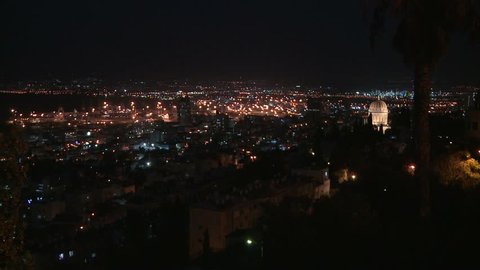HAIFA, ISRAEL CIRCA 2013 - Wide shot overlooking the city of Haifa, Israel at night with the Baha'i Temple in distance.