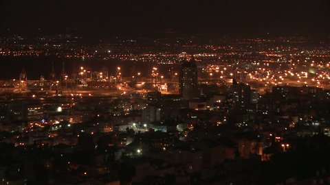 HAIFA, ISRAEL CIRCA 2013 - Pan across overlooking the city of Haifa, Israel at night with the Baha'i Temple in distance.