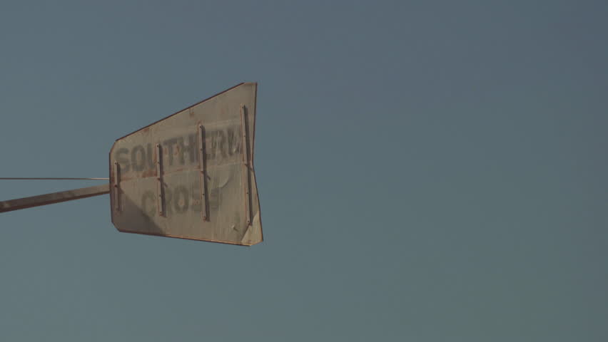 Sign for Southern Cross against a blue sky