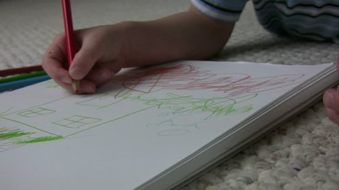 Close up of a kid coloring