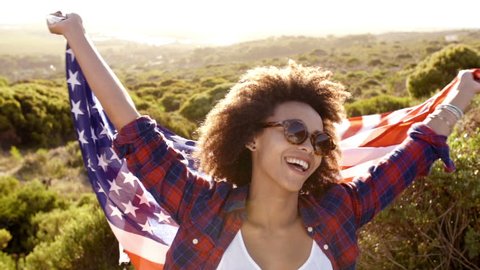 African american woman with stars and stripes : vidéo de stock