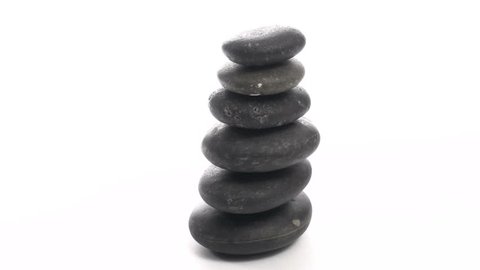 Seamless loop of stack of Zen or massage rocks isolated against white