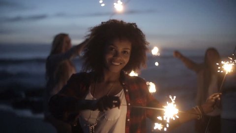 Group of friends with fireworks in slow motion Stock Video