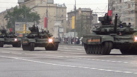 MOSCOW/RUSSIA - MAY 5: T-90A main battle tanks move in motorcade on Tverskaya Zastava square during night rehearsal of parade devoted to Victory Day on May 5, 2014 in Moscow.