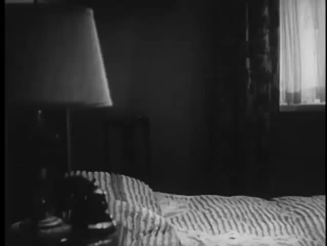 Panning shot ot hotel bedroom, 1940s