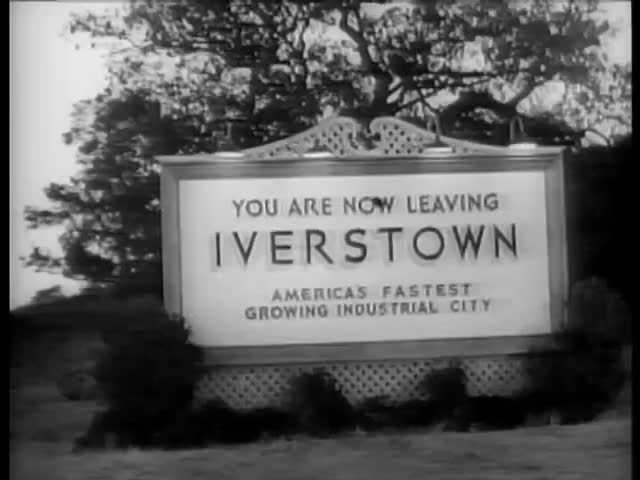 Point of view from car of Iverstown sign