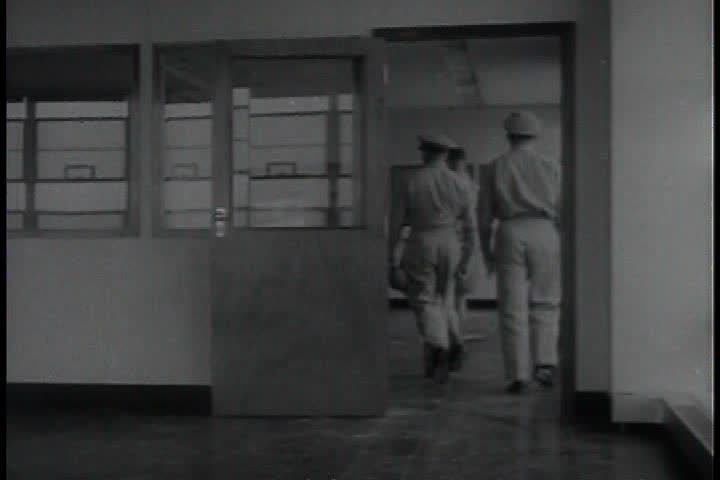 CIRCA 1940s - Roads are built on Okinawa Japan in 1949 and troops are trained.