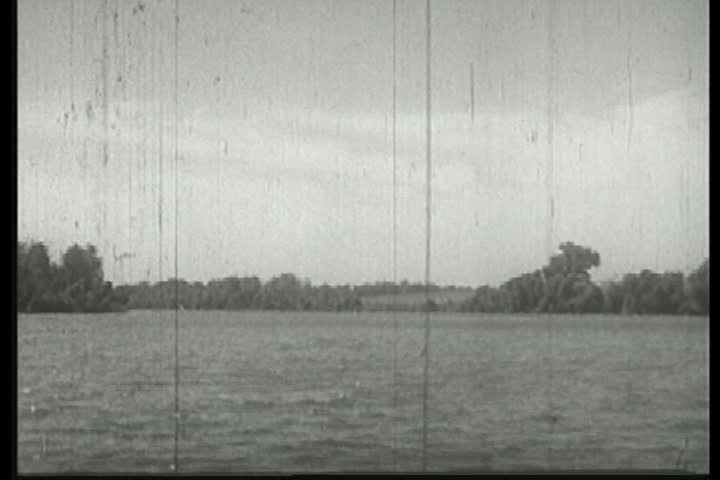 CIRCA 1940s - American men of the 1880s frontier cut down trees to make America great.