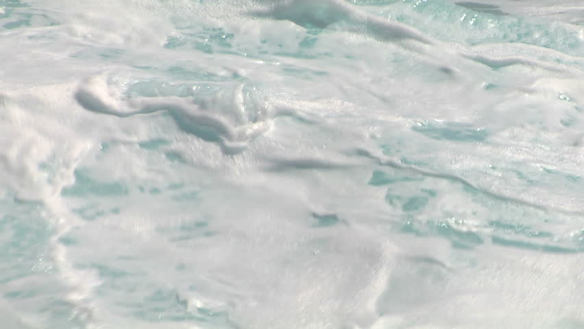 close up and slow motion of wave with plenty of foam