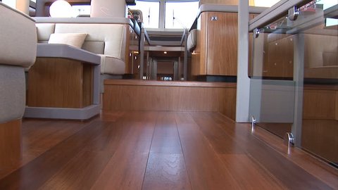 Living room of luxury yacht, with view of the cockpit. Camera movement made with jib crane
