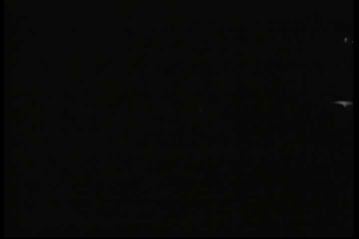 CIRCA 1950s - At a family picnic in 1950 a father uses tableware to build a model of a Chevrolet, showing off such innovations as center point steering, springs and shackles, shock absorbers