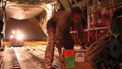 Afghanistan, Circa 2011:  Pallet of cargo waits to be loaded in helicopter cargo bay in  Afghanistan, Circa 2011