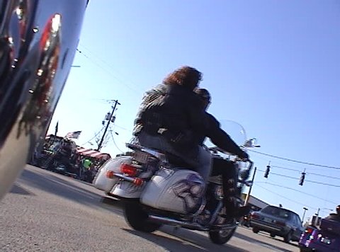 Riding down the street at motorcycle rally.