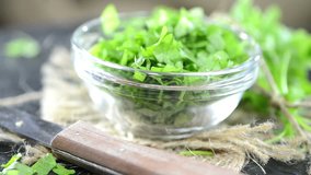 Fresh cutted Parsley in a small bowl as not loopable full HD video