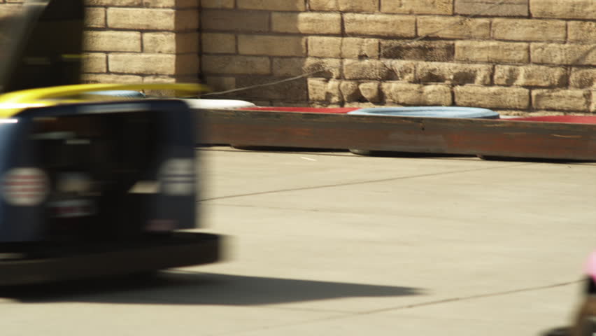 Wide Shot Young woman riding go-cart, Orem, Utah, USA