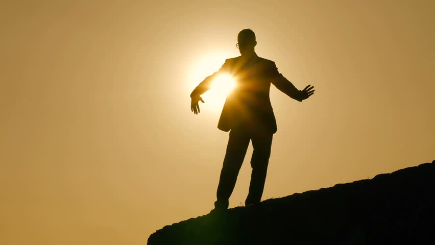 leisure activity at sunset. silhouette of man. body shape. recreational pursuit. male men person. sunset dusk magic hour. training fitness. nature energy