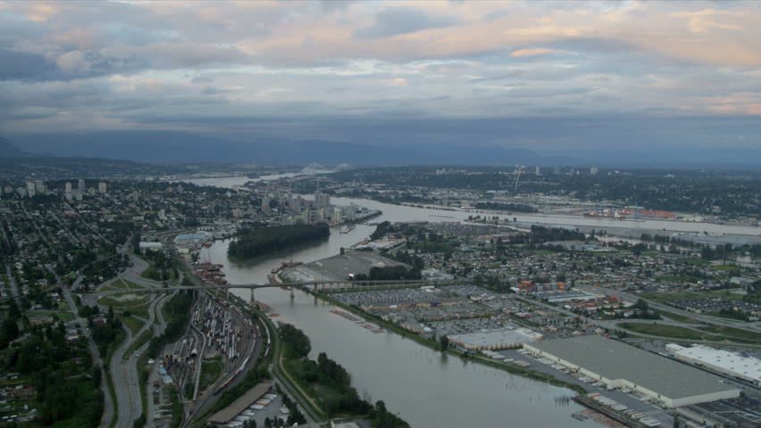 Aerial landscape sunset view residential suburbs New Westminster District, Queensborough Bridge, Fraser River, British Columbia, Canada