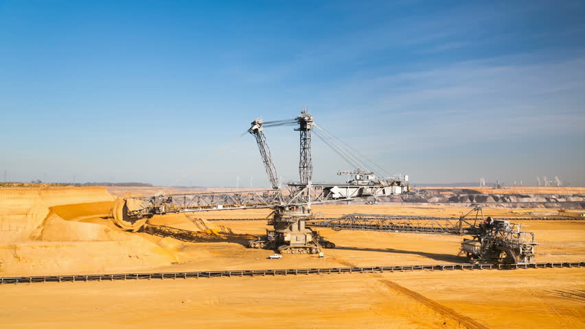 Timelapse of a giant Bucket Wheel Excavator at work in an endless lignite pit mine in 4K resolution