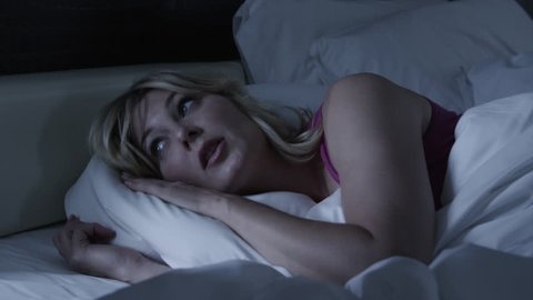 Medium Shot Woman sleeping in bed 