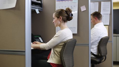 Medium Shot Woman using computer in office 