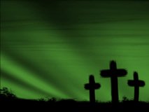 Loop of 3 silhouetted crosses and green moving sky