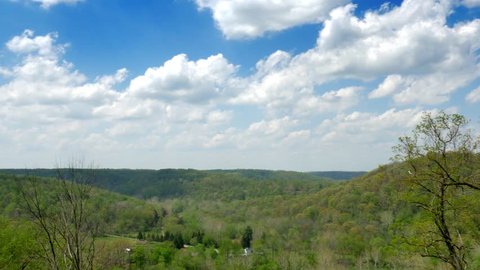 A gentile time lapse view of a Pennsylvania valley on a sunny day.