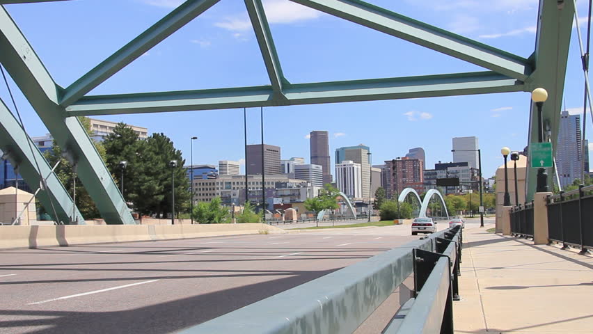 Denver commuters drive into downtown over a bridge