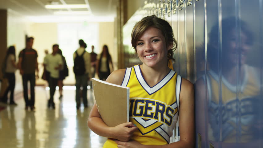 Medium Shot Portrait of female student in school corridor