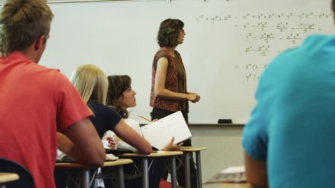 Medium Shot Teacher talking to students during classes 