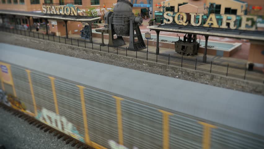 A cargo train passes by Station Square in Pittsburgh, PA.