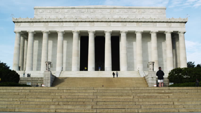 Wide Shot Rear view of family with two children (4-5, 6-7) ascending steps at Abraham Lincoln Memorial , Washington D.C, USA