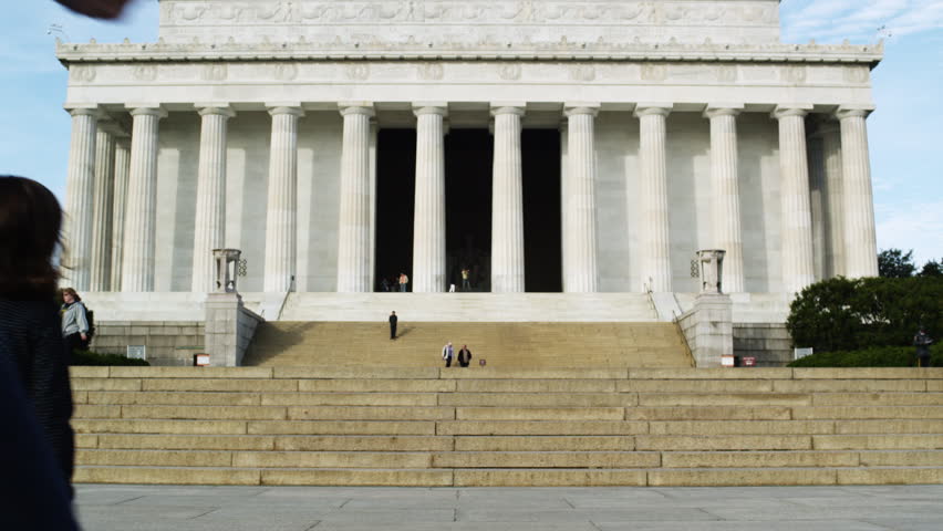 Wide Shot Woman photographing man with two children (4-5, 6-7) in front of Abraham Lincoln Memorial , Washington D.C, USA