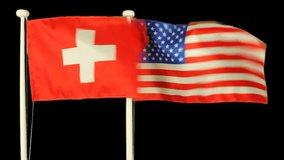 Waving flags of Switzerland and USA, isolated by chroma key. Real polyester flag on white wooden flag pole. No animation or slow motion.