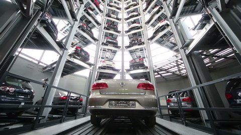 MOSCOW, RUSSIA - JAN 11, 2013: Time lapse of moving lift with car in tower for storage and presentation in Varshavka Center. Tower was designed and built in 2009.