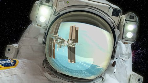 Стоковое видео: Astronaut - Space background -  Space station reflected in visor