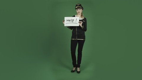 caucasian air hostess isolated on chroma green screen background help sign