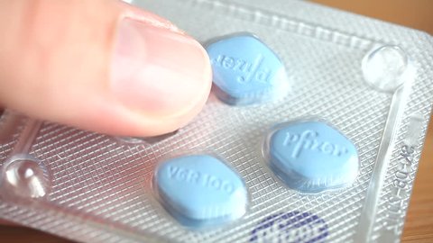 KUSADASI, TURKEY - JAN 20: Blue Viagra pills being removed from a blisterpack on January 20, 2010 in Kusadasi, Turkey. Viagra was developed by Pfizer as an erectile dysfunction drug.