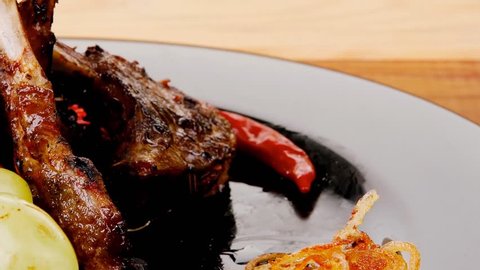 roast ribs on wooden table with grapes 1920x1080 intro motion slow hidef hd