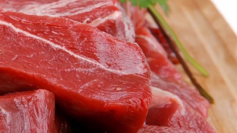 fresh uncooked beef meat slices over wooden cutting board ready to prepare with green hot and red peppers 1920x1080 intro motion slow hidef hd