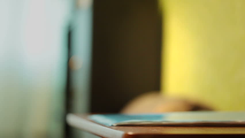 Somebody is holding keys on the table
