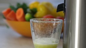 squeezing vegetable green juice. cooking on a juicer