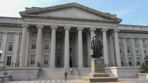 WASHINGTON, DC - MAY 2014:  US Treasury Department,  two people go up stairs at west entrance (Pennsylvania Ave), one of  the building's two "fronts."