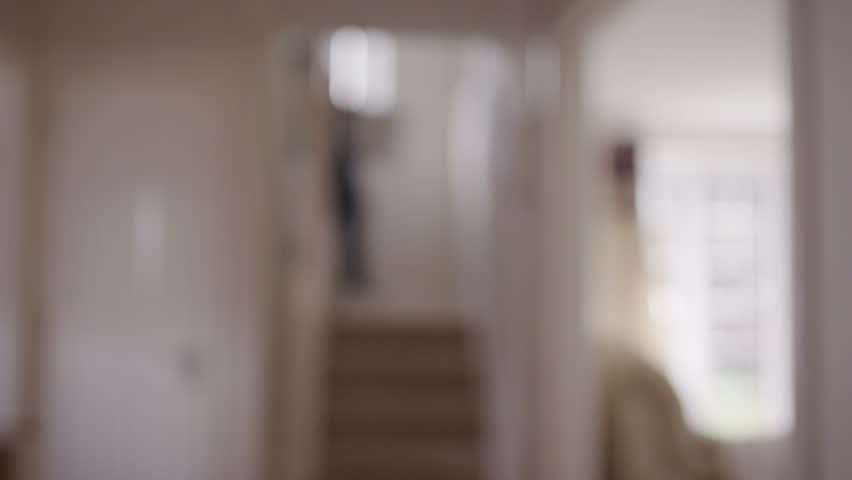 Man bringing laundry down stairs | Shutterstock HD Video #6394715